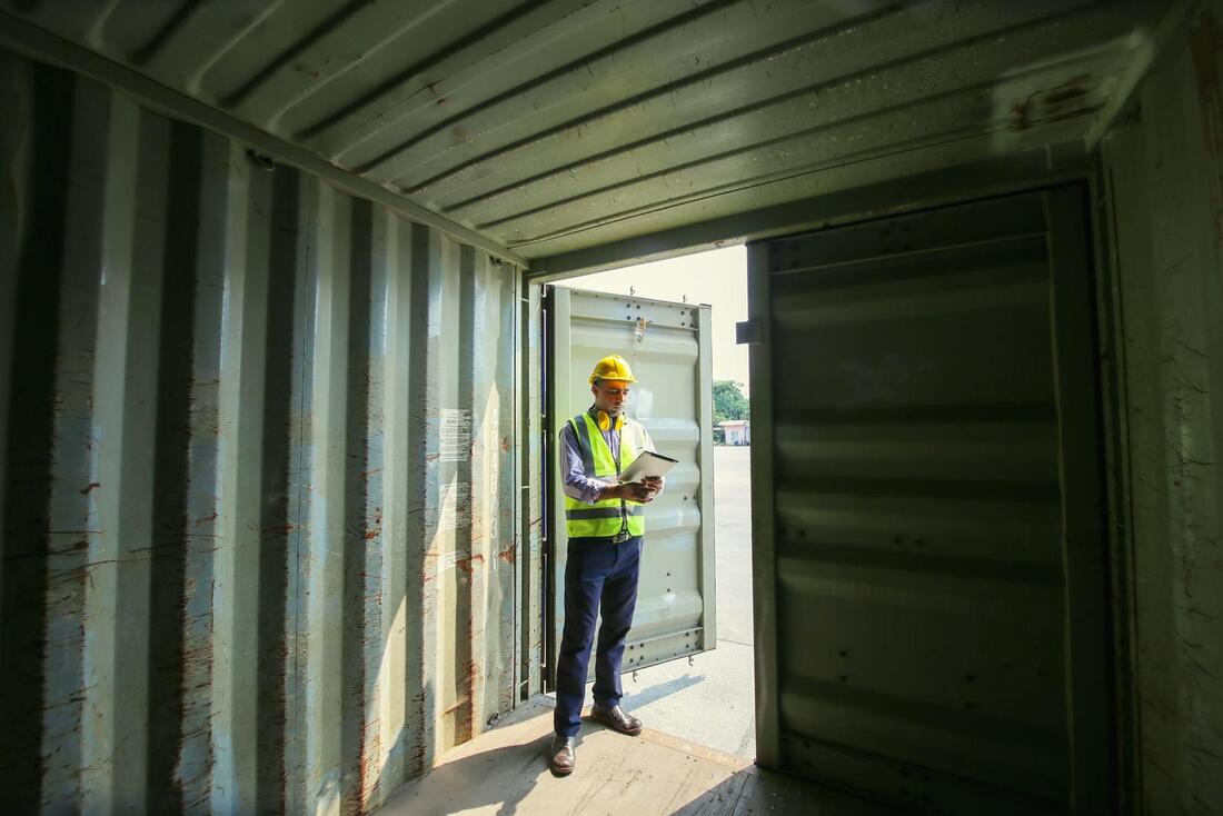 worker inside the steel container